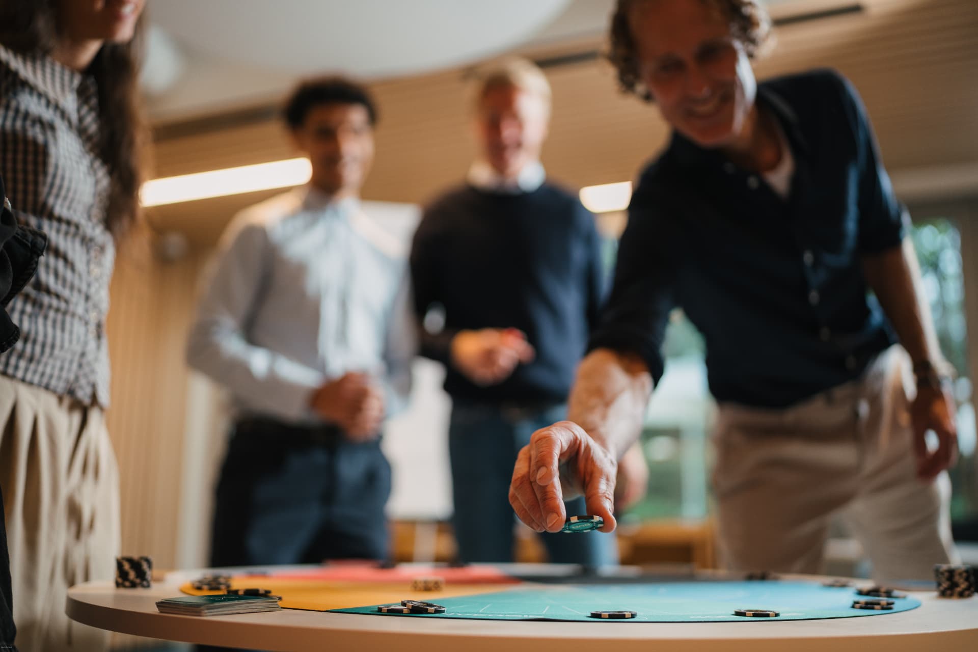 A participant placing a chip on The Revenue Run board