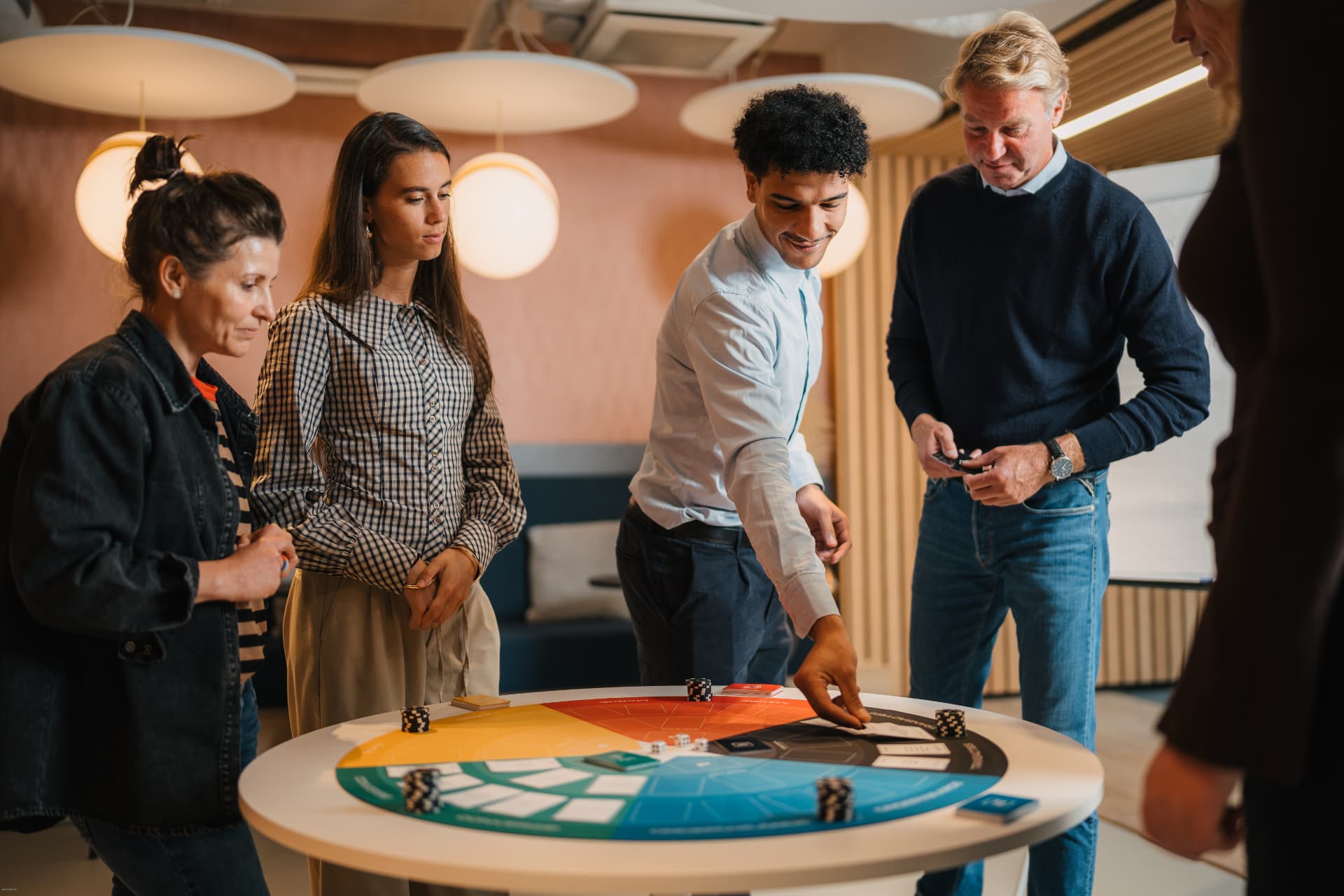 A leadership team playing The Revenue Run around the table