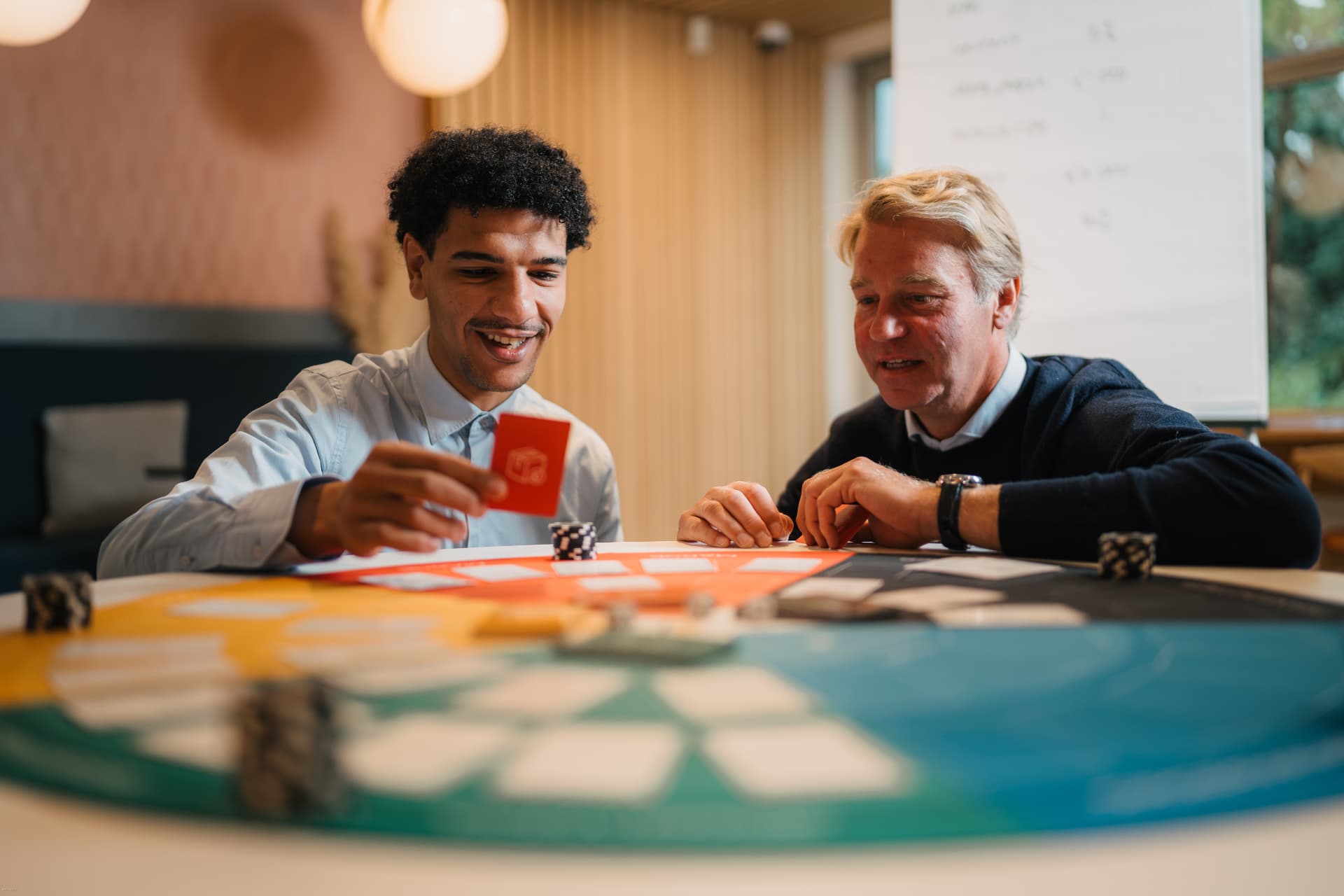 Two participants making decisions together during The Revenue Run